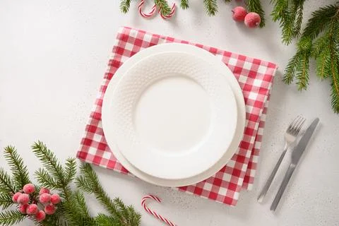 Christmas table setting with elegant red decorations on white table. View f.. Stock Photos