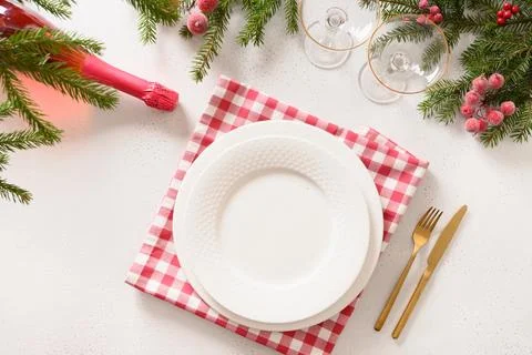 Christmas table setting with elegant red decorations on white table. View f.. Stock Photos