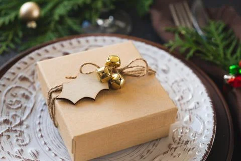 Christmas Table Setting With Gift Box. Winter Festive background. Stock Photos