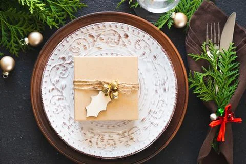 Christmas Table Setting With Gift Box. Winter Festive background. Stock Photos