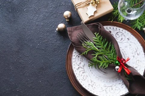 Christmas Table Setting With Gift Box. Winter Festive background. Stock Photos