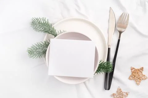 Christmas table setting for holiday dinner top view. Mockup paper blank wit.. Stock Photos