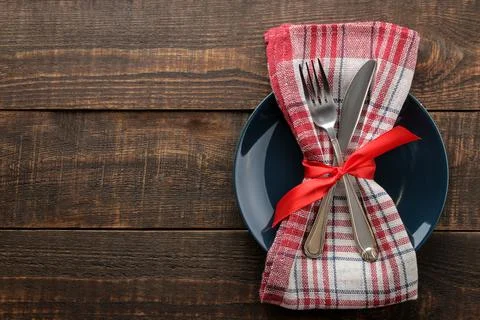 Christmas table setting. Knife, fork and plate with new year decorations. on Stock Photos