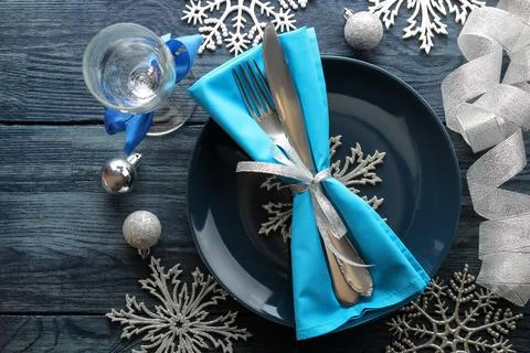 Christmas table setting. Knife, fork and plate with new year decorations. on Stock Photos