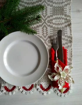 Christmas table setting on a linen tablecloth. Stock Photos