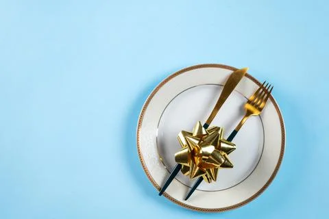 Christmas table setting with modern dishware and decorations on blue backgrou Stock Photos