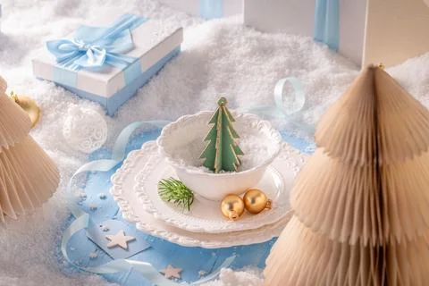 Christmas Table Setting with Paper Tree and Baubles Stock Photos