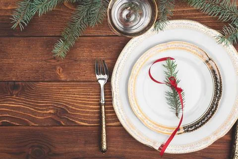 Christmas table setting with pine tree branches and decorations top view Stock Photos