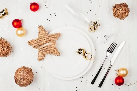 Christmas table setting with red and golden decorations. Stock Photos