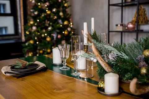 Christmas table setting in rustic style with candles, plates, glasses and eco Stock Photos