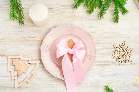 Christmas table setting top view. Wooden toy in the shape of snowflakes and a Stock Photos