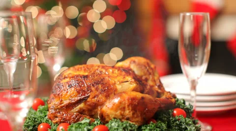 Christmas table setting with turkey on platter Stock Footage