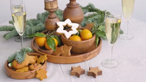 Christmas table at the winter window. Two glasses of champagne, candles in Stock-Footage 143967224