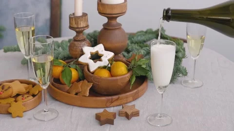 Christmas table by the winter window. Two glasses of champagne, candles in 스톡 동영상 144089598