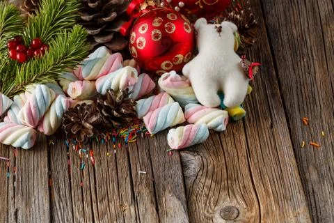 Christmas theme. Pine and red ball on wooden table Stock Photos
