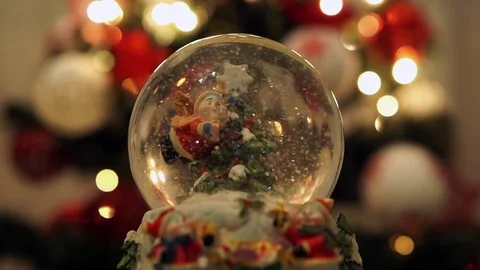 Christmas theme, Snow globe with blurry lights Stock Footage 99059747