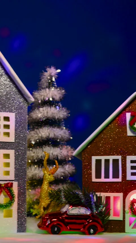 Christmas town with decorated multi-colored houses, Christmas trees and cars Video stock 289601133