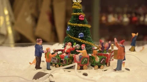 Christmas Toy Model Train on Miniature Railway Track Stock Footage 342318691
