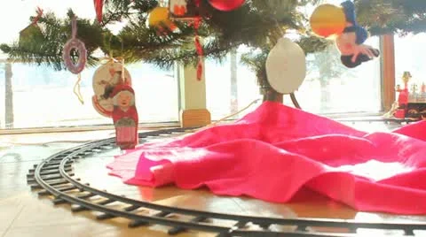 Christmas Train around the base of a tree Stock Footage 12760429