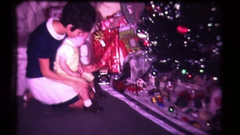 Christmas Train Under Tree Gifts and Presents at American Christmas Celebration  Stock Footage 130353652