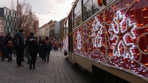 Christmas tram in crowded Brno central street fair in winter Stock Footage 99856783