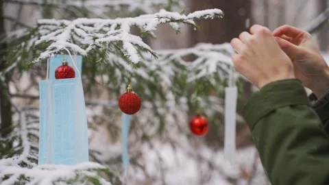 Christmas tree in 2020 decorated with festive lights, balls, huge star and Stock Footage 143910053