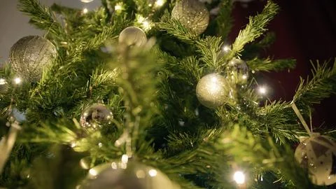Christmas tree adorned with silver and white balls and lights Stock Photos