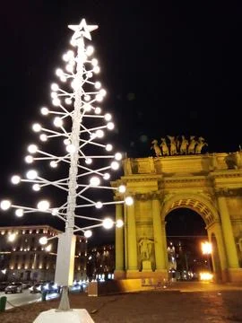 Christmas tree against the backdrop of the triumphal gates Stock Photos