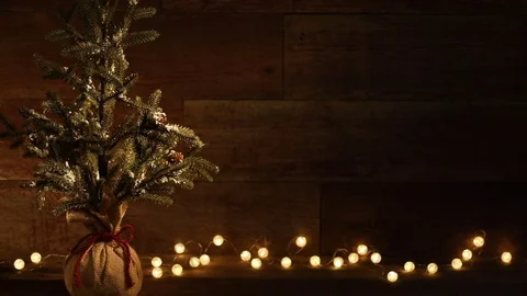 Christmas Tree and candles on retro wood background video Stock Footage 82668822