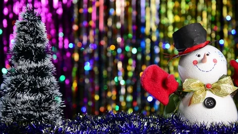 Christmas tree and falling confetti over snowman Stock Footage 121445439