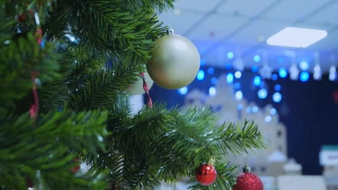 A Christmas tree and a silver box with a red ribbon on it Video stock 278099679