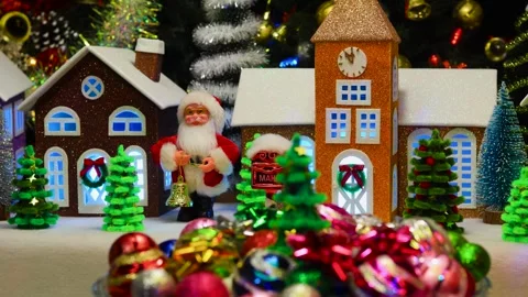 Christmas tree and various decorations rotates against of a Christmas town Stock Footage 292876448