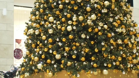 Christmas tree artificial plastic tree with decorations golden bulb ball xmas Stock Footage 100237174