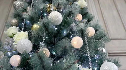 Christmas tree in artificial snow decorated with bright toys and flowers Stock Footage 226795155