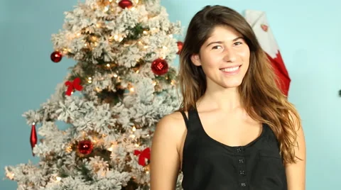 Christmas tree background Smiling teen girl portrait Stock Footage 44515341