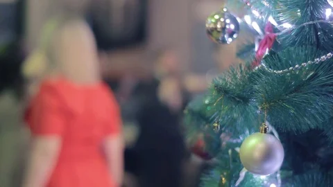Christmas tree on the background of unrecognizable people dancing Stock Footage 103049240