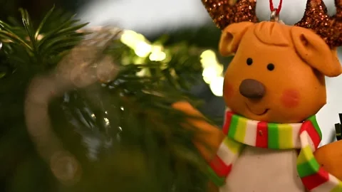 Christmas tree, bear with scarf looking at it from left to right Stock Footage 227713997
