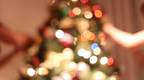 Christmas tree being assembled by two people Stock Footage