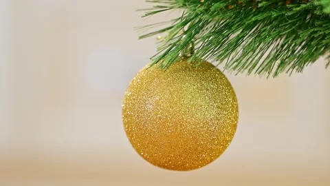 Christmas tree on blurred background with golden ornaments Stock Footage 278211346