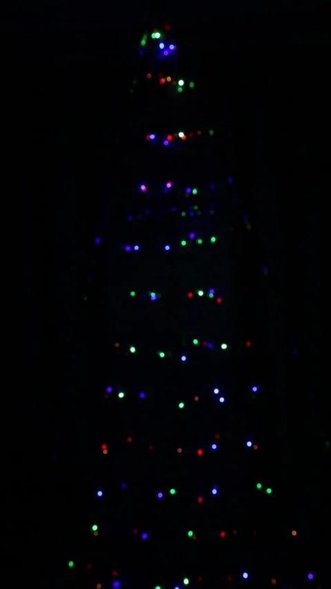 Christmas tree bokeh lights blinking slowly and smoothly in dark scene Stock Footage 340533392