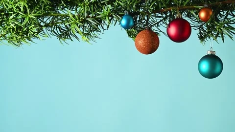 Christmas tree branch with multi colored baubles Stock Footage 255736573