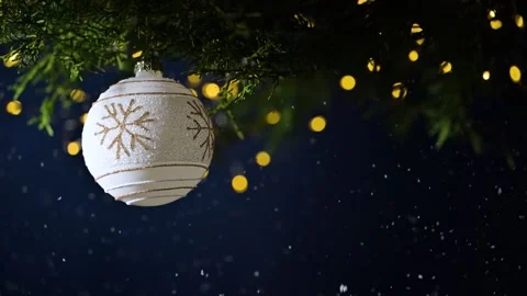 Christmas tree branch with white bauble and lights Stock Footage 254662940