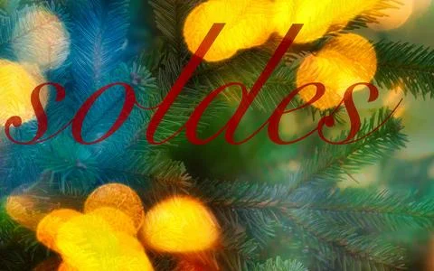 Christmas tree branches with bokeh lights and red text sales announcement Фото