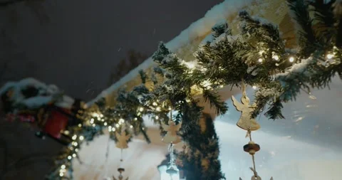 Christmas tree branches with snow and toys with lights decorated in the park. Stock Footage 314633727
