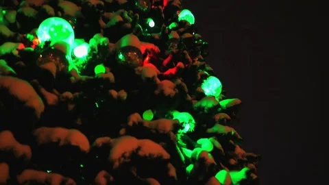 Christmas tree. The camera moves from bottom to top. Lights of a garland  Stock Footage 83861886