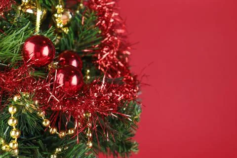 Christmas tree close-up, spruce branches with red balls Stock Photos