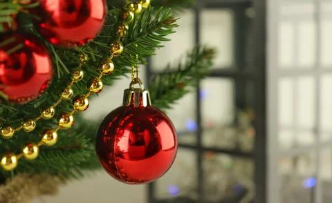 Christmas tree close-up, spruce branches with red balls Stock Photos