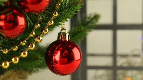 Christmas tree close-up, spruce branches with red balls Stock Photos