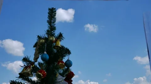 Christmas tree on clouds background time lapse 스톡 동영상 57999528