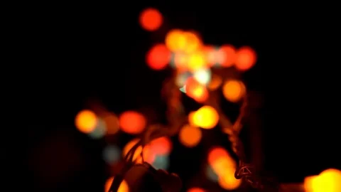 Christmas tree with colored lights and toys revolve on a black background Stock Footage 83320005